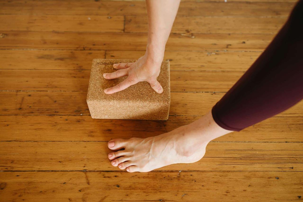 image of a hand on a yoga block
